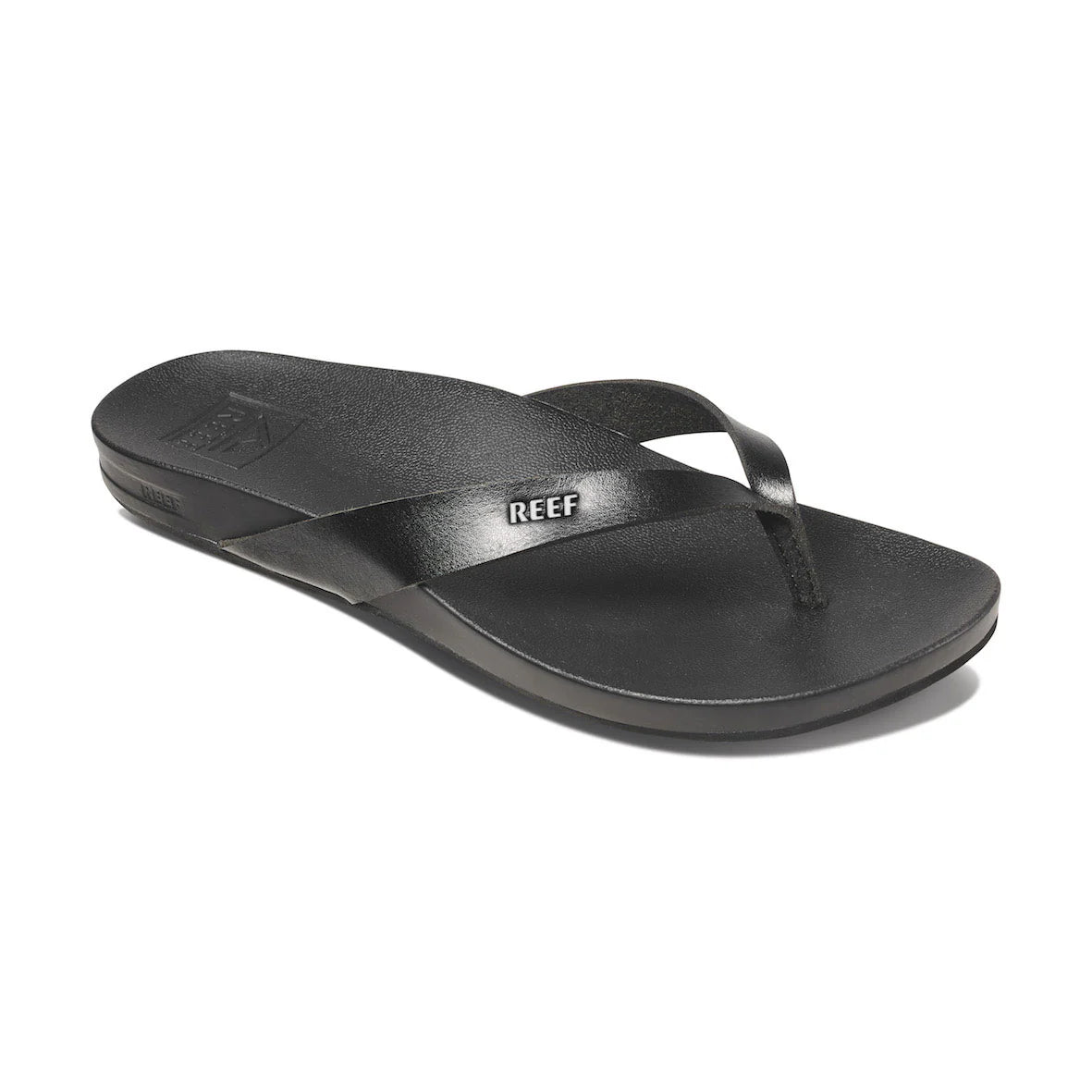 Side view of black Reef Cushion Court sandal with REEF branding on white background