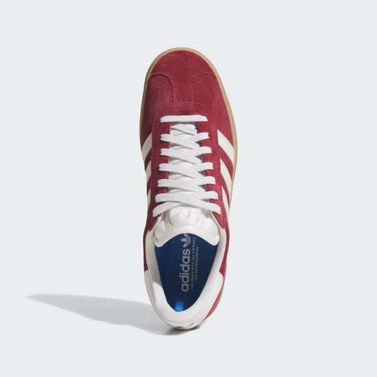 Top view of burgundy Adidas Gazelle ADV sneaker with white laces and stripes on light grey background