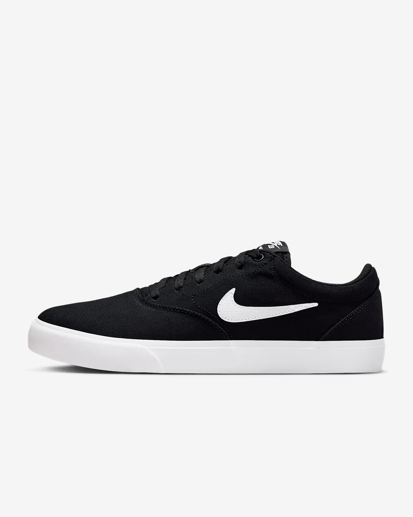 Side profile view of black Nike SB Charge Canvas sneaker with white swoosh logo and white midsole on white background