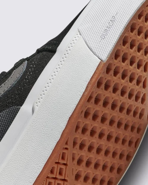 Close-up of gum waffle sole and white midsole of BMX Old Skool skate shoe with grey upper